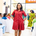 A woman models a red shirt dress during the Style, Shop & Sip fashion event.