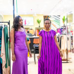 Two guests pose in contrasting purple dresses during Style, Shop & Sip with Connie Oluoch.