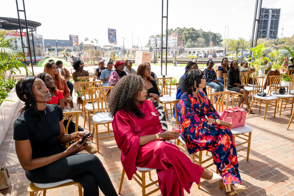 Guests sit in rows of chairs on an outdoor terrace during a Galleria Shopping Mall event.
