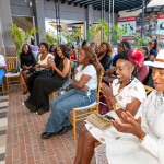Audience Applauding at Wellness Within Event An audience applauds and smiles while seated at the Wellness Within event inside the mall.
