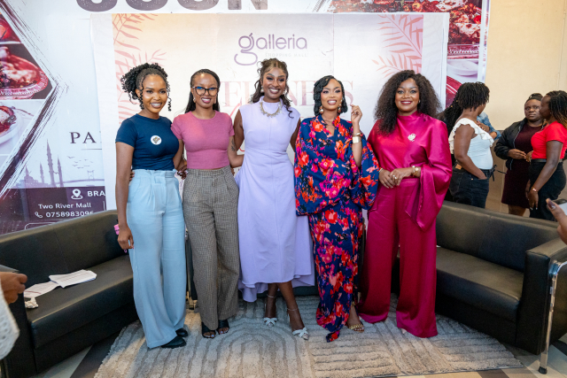 Five women pose together in front of a Galleria Wellness Within event backdrop.