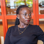 Portrait of a woman wearing glasses and a black top at the tasting event